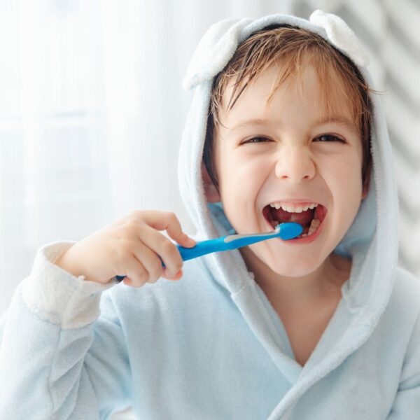 Child with toothbrush