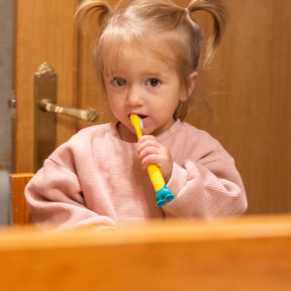 Adorable Baby Girl Brushing Teeth. Emphasizing Children's Dental Care, Healthy Practices, Education, Health, And Establishing Early Daily Routines