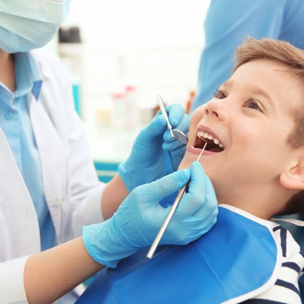 Child receiving dental treatment