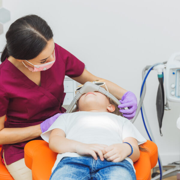 Dental treatment. Superficial sedation. Treatment of children's teeth with nitrous oxide. children's dentistry.