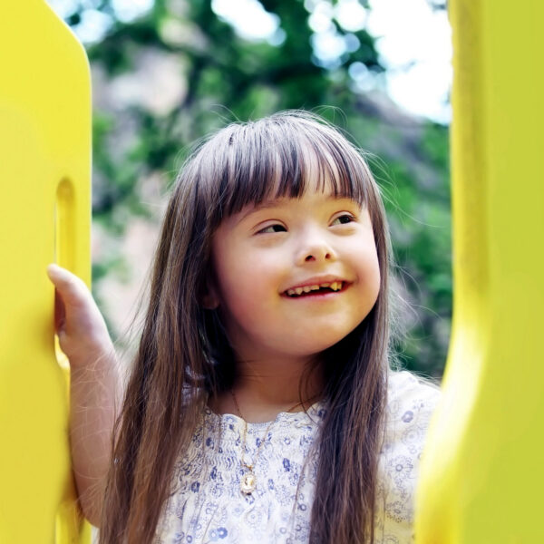 Portrait of beautiful young girl on the playground.